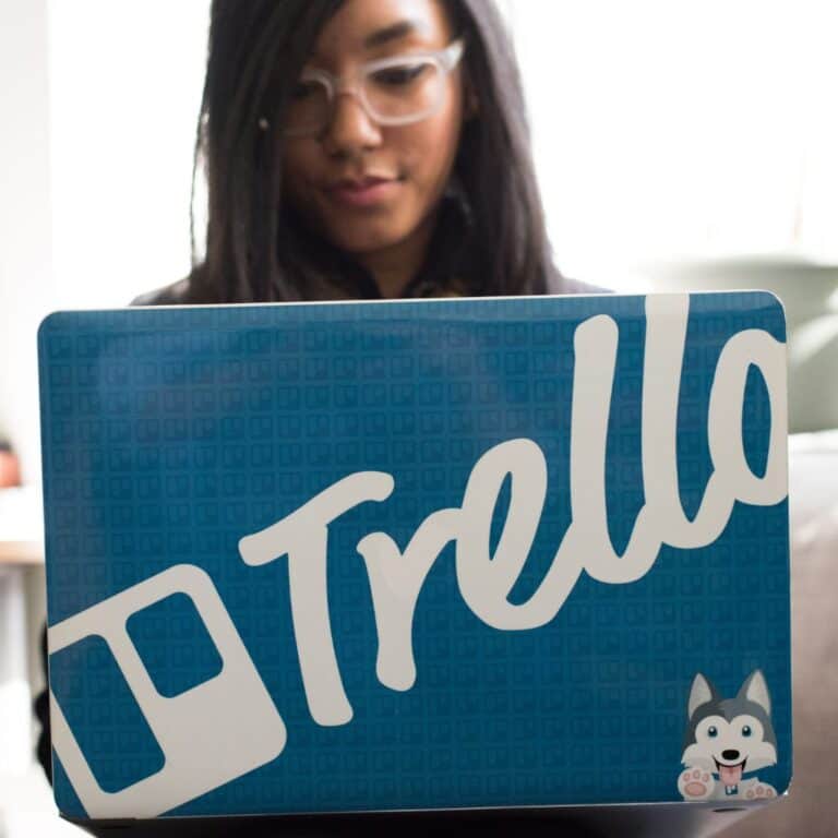 woman on laptop with trello logo representing trello for blogging